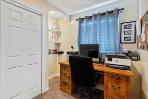 Office space with light colored carpet