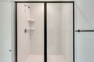 Full bath featuring a stall shower