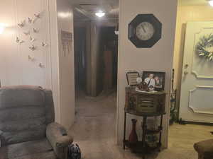 Hall featuring a decorative wall