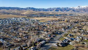 Aerial view of property's location with nearby suburban area