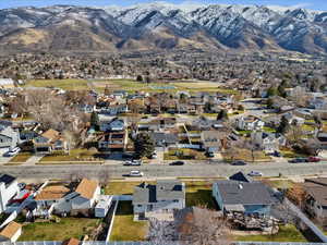 Aerial view of property's location with nearby suburban area and mountains