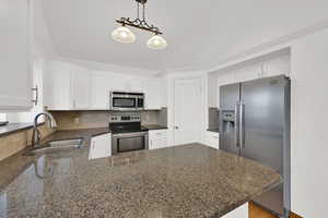 Updated kitchen with freshly painted & plentiful cabinets, granite counter tops, walk-in pantry.
