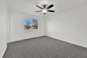 Primary bedroom with en-suite, walk-in closet and new carpet with fresh paint.