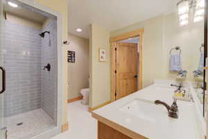 Master bedroom ensuite bathroom with shower and double vanities, walk in closet