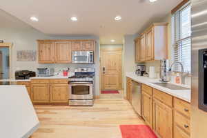 Open plan kitchen area, stainless steel appliances