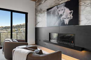 Living room with a fireplace and wood finished floors