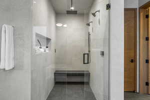 Full bath with a tile shower