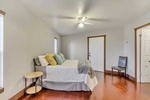 Bedroom featuring wood-type flooring and a ceiling fan