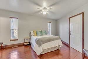 Bedroom featuring hardwood / wood-style flooring and ceiling fan