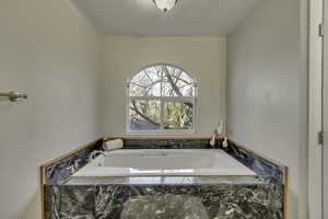 Full bathroom with a bath