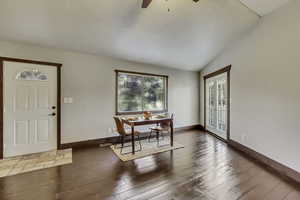 Dining room with lofted ceiling, a ceiling fan, and light wood-style floors