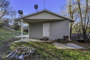 Rear view of house featuring a patio