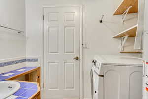 Laundry room featuring separate washer and dryer