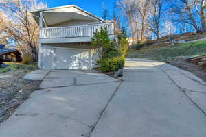 View of front of house featuring driveway and an attached garage