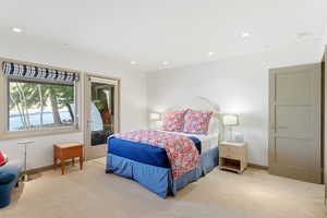 Carpeted bedroom featuring access to exterior and recessed lighting