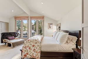 Carpeted bedroom with access to outside