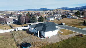 Aerial view of residential area featuring mountains