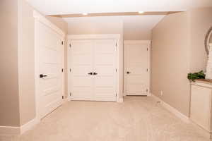 Unfurnished bedroom featuring carpet flooring and a closet