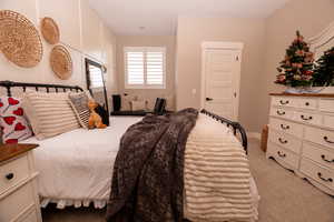 Bedroom with carpet flooring and baseboards