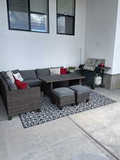 View of patio featuring area for grilling and an outdoor living space