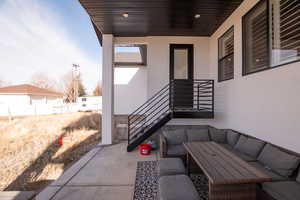 View of patio with an outdoor living space
