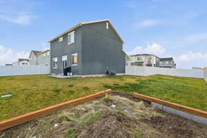 View of side of property featuring a residential view, a patio area, and a fenced backyard