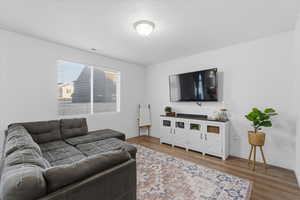 Living room with wood finished floors and baseboards