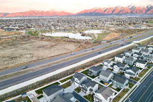 Aerial view at dusk of a residential view and a water and mountain view