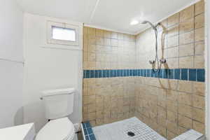 Bathroom with a shower stall and recessed lighting