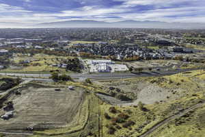 Aerial view of property's location featuring a mountain backdrop