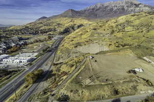 Aerial overview of property's location with a mountainous background