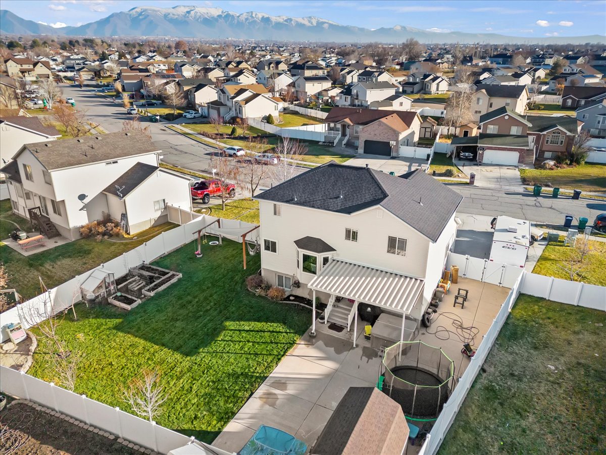 Aerial view of residential area featuring a mountain backdrop
