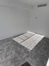 Unfurnished room with carpet flooring and baseboards