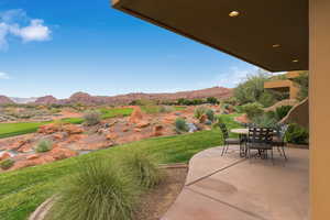 View of patio featuring a mountain view and outdoor dining area