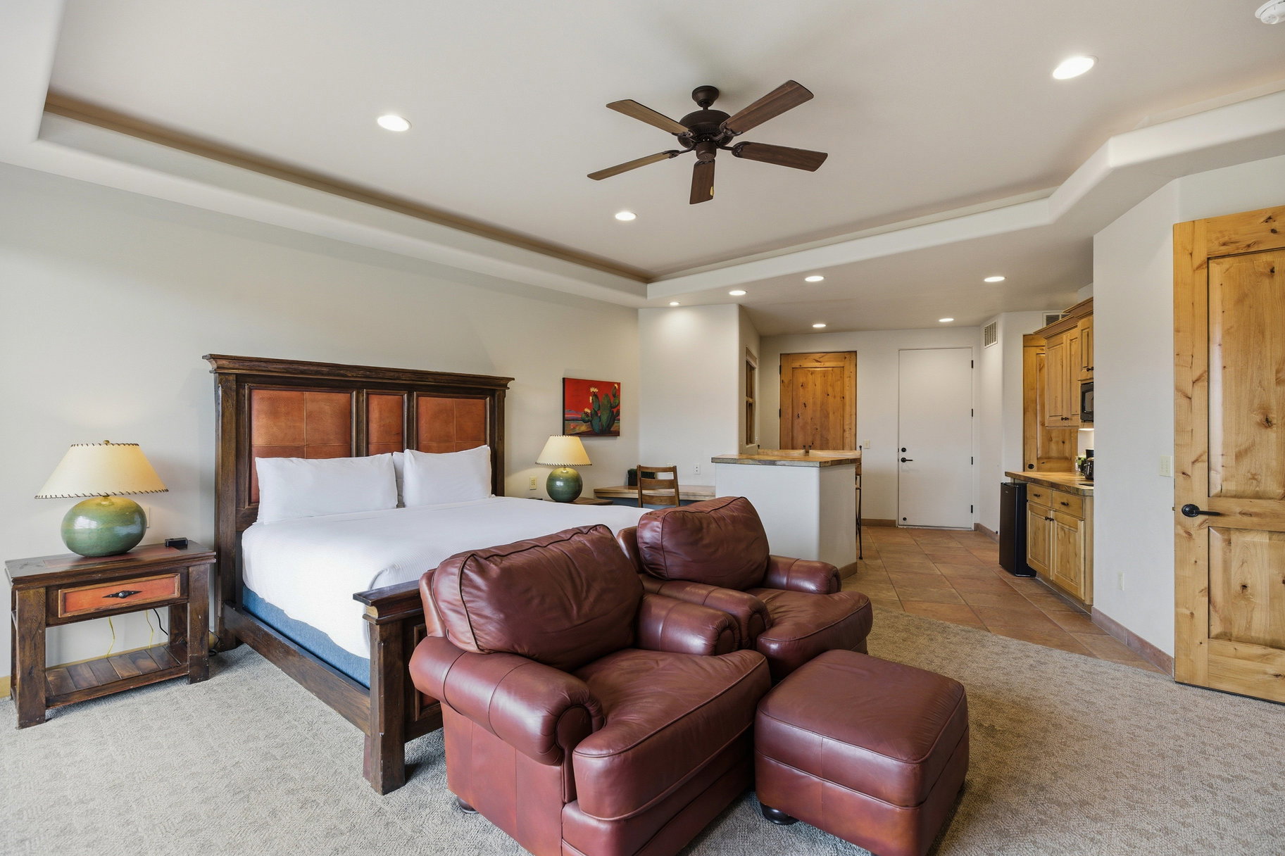 Bedroom with a tray ceiling, recessed lighting, a ceiling fan, and light tile patterned floors