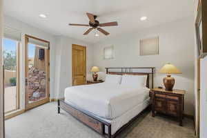 Carpeted bedroom with access to exterior, a ceiling fan, and recessed lighting