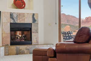 Living area with a premium fireplace and a mountain view