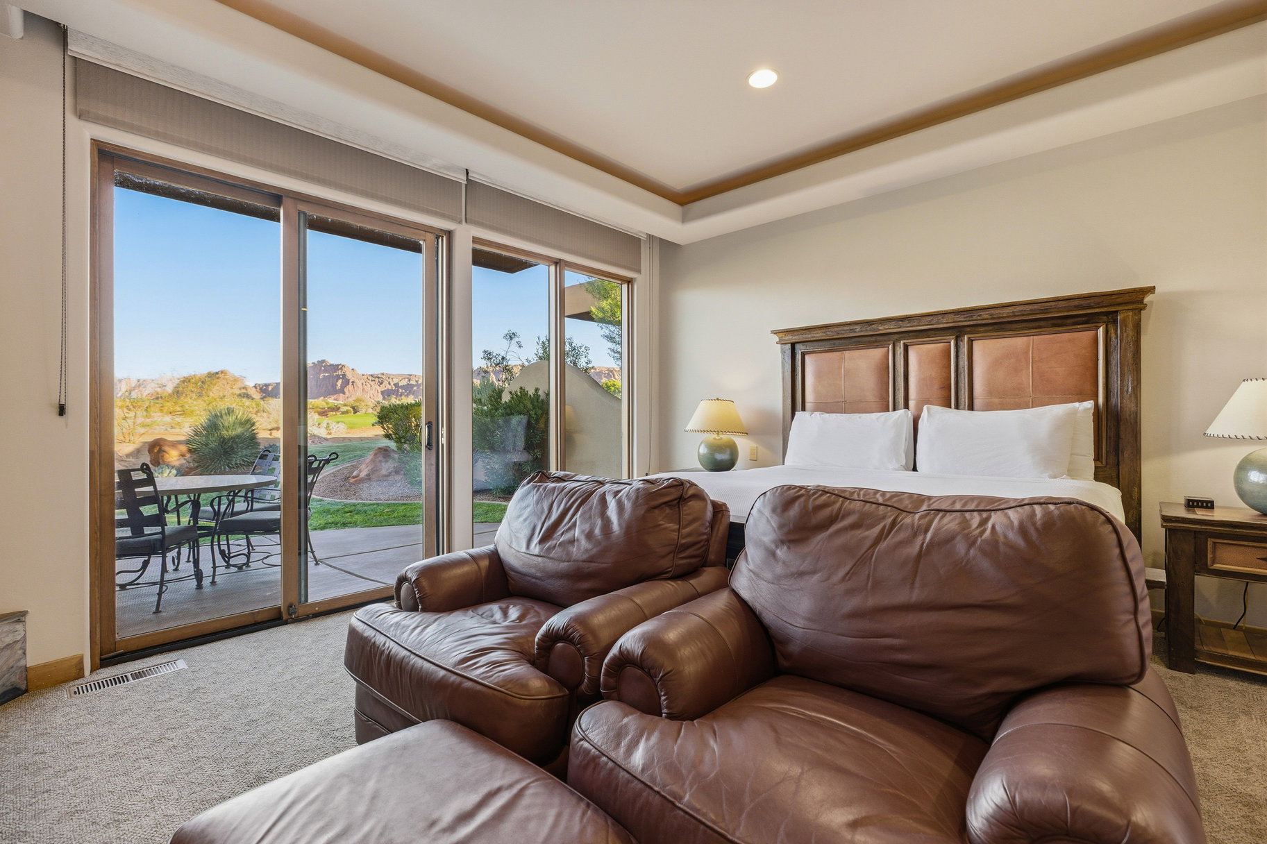Carpeted bedroom featuring access to exterior and recessed lighting