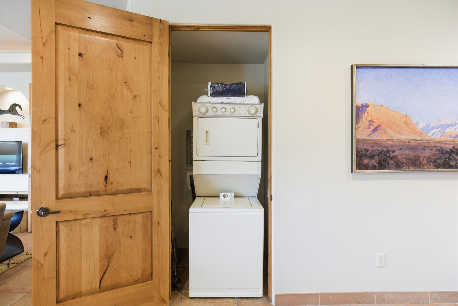 Laundry area featuring stacked washer / drying machine