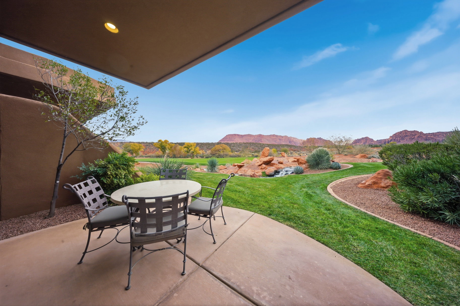 View of patio with outdoor dining space and a mountain view