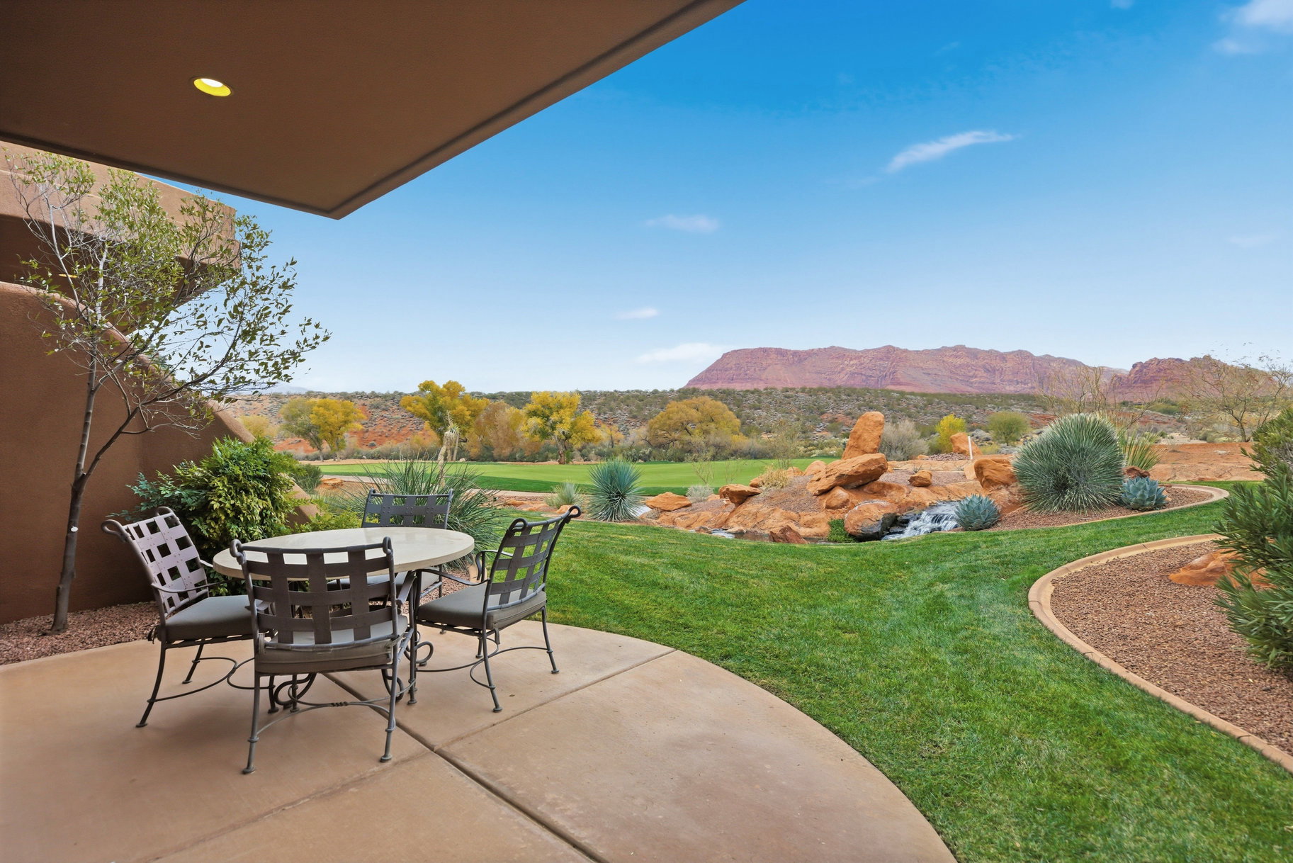 View of patio featuring outdoor dining area and a mountain view