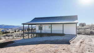 Exterior space featuring a mountain view