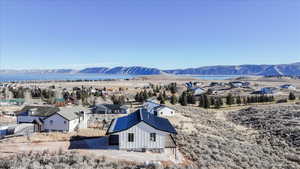 View of mountain backdrop featuring nearby suburban area
