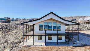 Rear view of house featuring a patio area