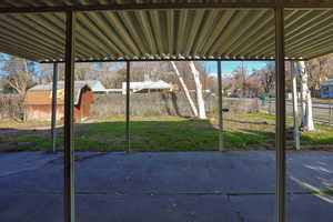 Fenced backyard with a shed