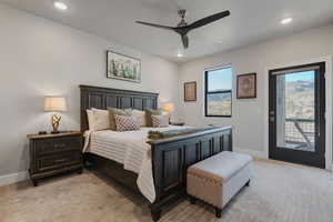 Bedroom with access to outside, a ceiling fan, light colored carpet, and recessed lighting