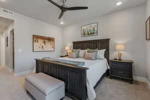 Bedroom with a ceiling fan and recessed lighting