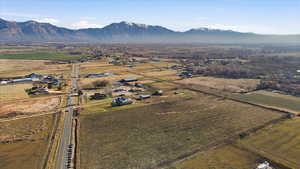 Aerial view of property and surrounding area with mountains and rural landscape