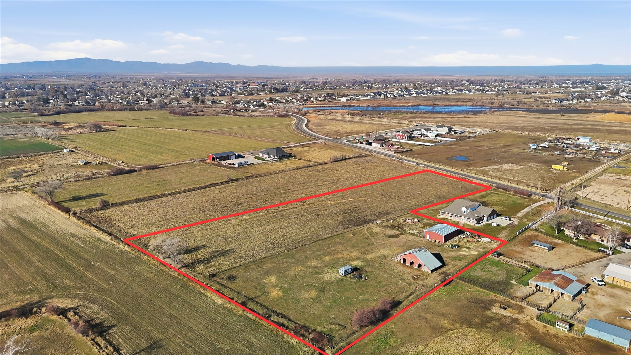 Overview of rural landscape with mountains and property boundaries highlighted