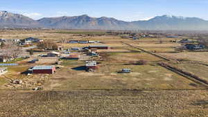 Overview of rural landscape featuring a mountain backdrop